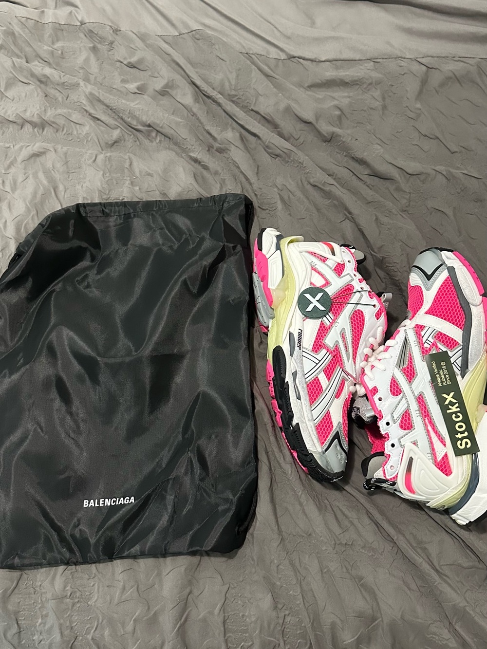 pink and white Balenciaga runners
